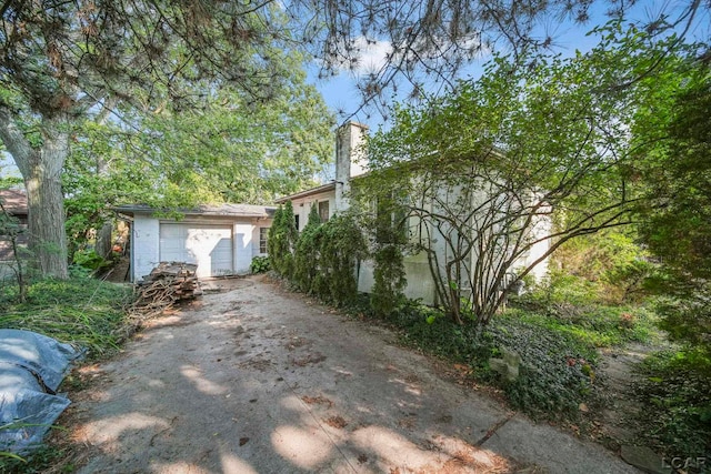 view of property exterior featuring a garage