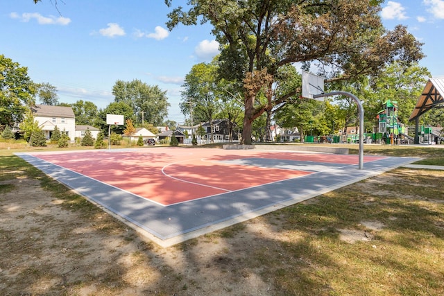 view of sport court featuring a playground