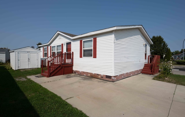 exterior space with a patio area and a storage shed