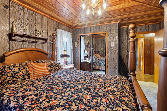 bedroom featuring a closet, wooden ceiling, wooden walls, and vaulted ceiling