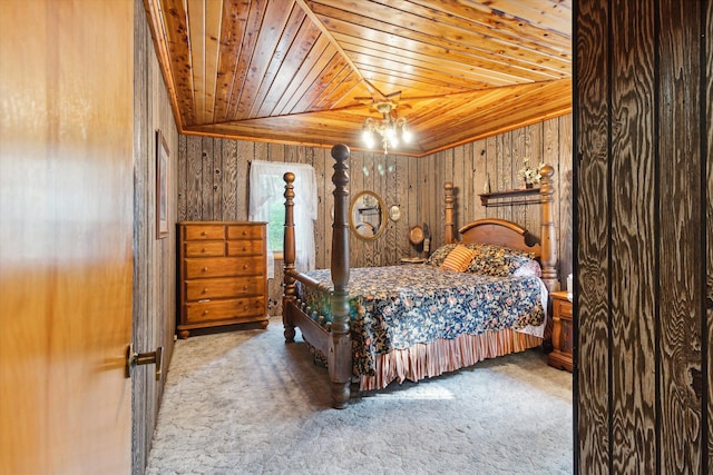 bedroom with wood walls, carpet, wooden ceiling, and vaulted ceiling