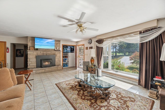 5563 Spring Creek Rd, Three Oaks, MI 49128 - living area featuring ceiling fan, a fireplace, and light tile patterned floors