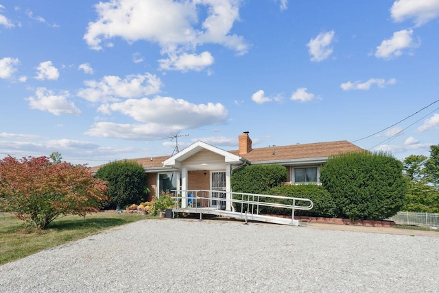 5563 Spring Creek Rd, Three Oaks, MI 49128 - ranch-style house with a chimney and brick siding