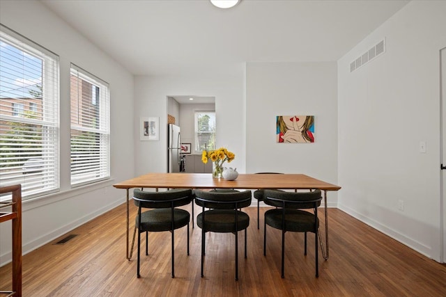 dining area with wood-type flooring