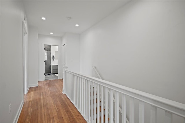 hallway with light hardwood / wood-style flooring