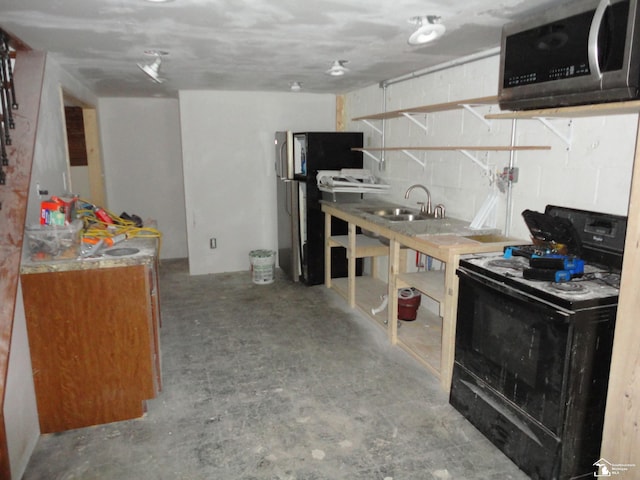 kitchen featuring sink and electric range