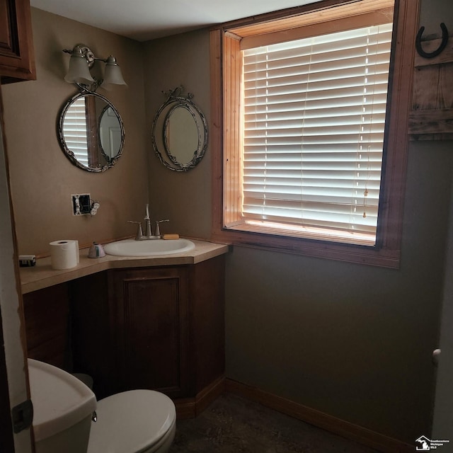 bathroom with vanity and toilet