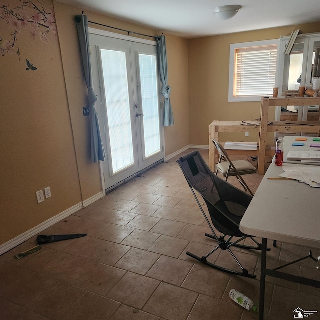 office area with french doors and a healthy amount of sunlight