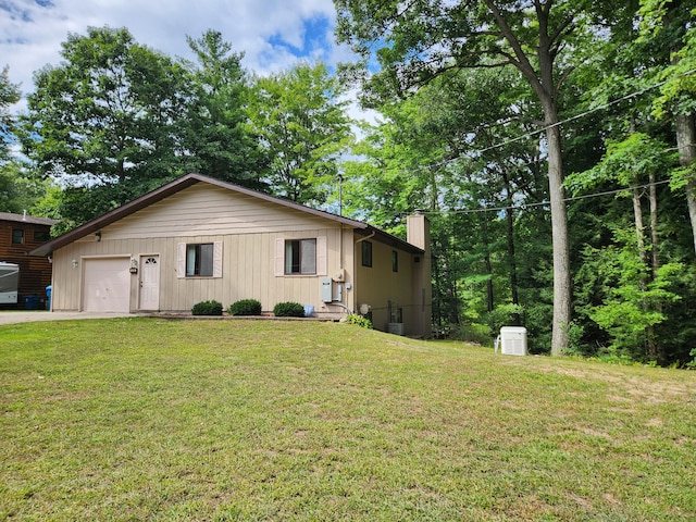 view of front of house with a garage and a front yard