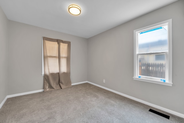 spare room with light colored carpet