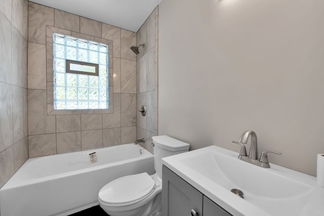 full bathroom featuring vanity, toilet, and tiled shower / bath combo