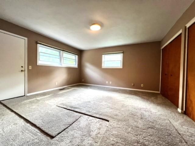 unfurnished bedroom with carpet flooring