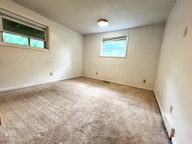 spare room featuring carpet floors