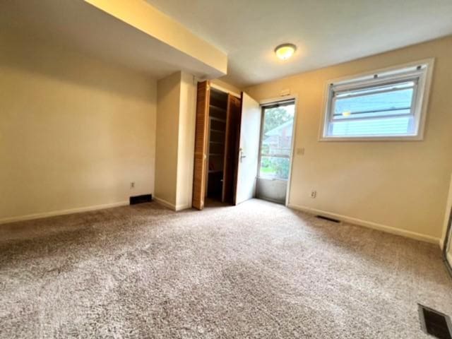 unfurnished bedroom featuring carpet