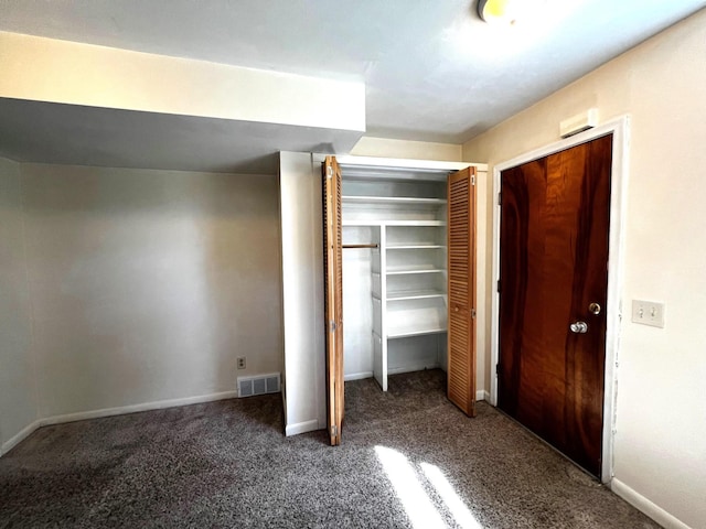 unfurnished bedroom with carpet floors