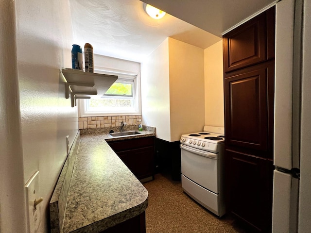 kitchen featuring white appliances, dark brown cabinetry, and sink