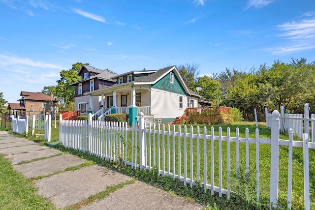 view of front of house with a front lawn and a porch