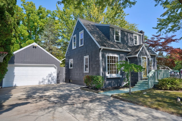 view of front facade with an outbuilding and a garage