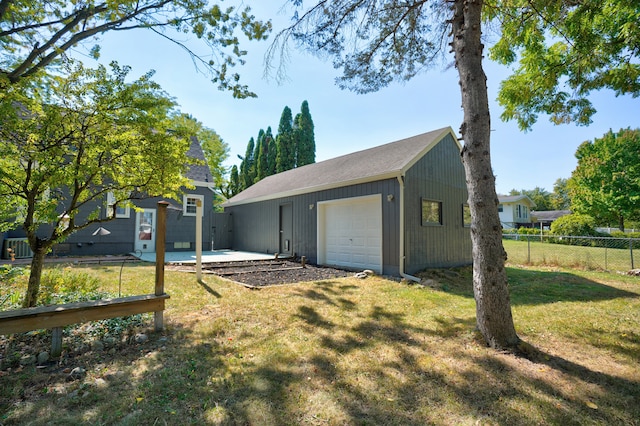 garage with a lawn