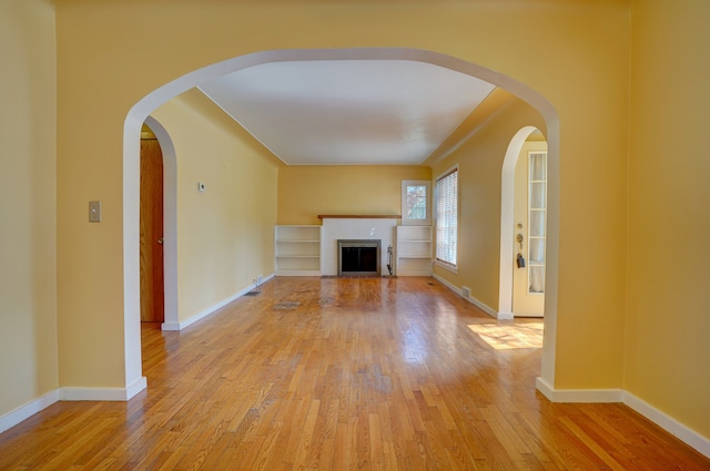 unfurnished living room with light hardwood / wood-style floors