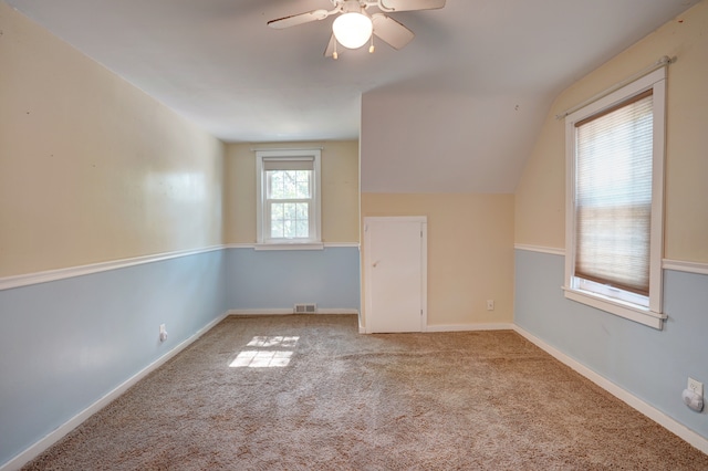 bonus room with light colored carpet, ceiling fan, and lofted ceiling