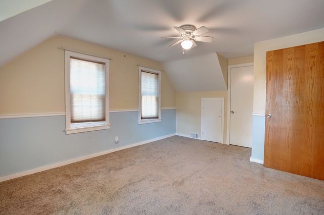 bonus room featuring carpet flooring, ceiling fan, and vaulted ceiling