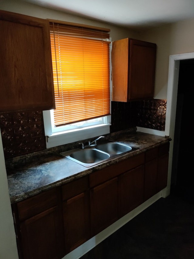 kitchen with tasteful backsplash and sink