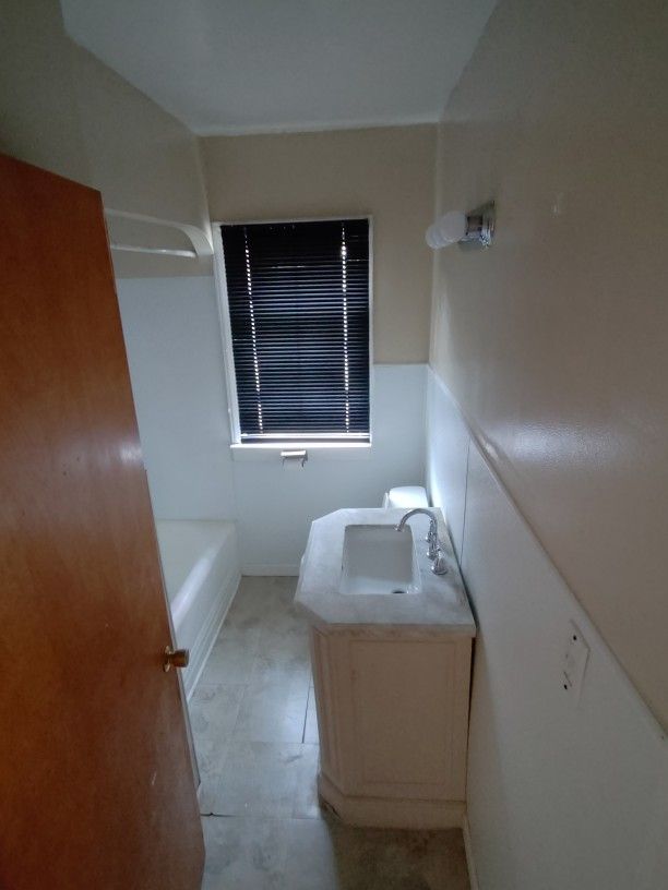 bathroom featuring a bath and vanity