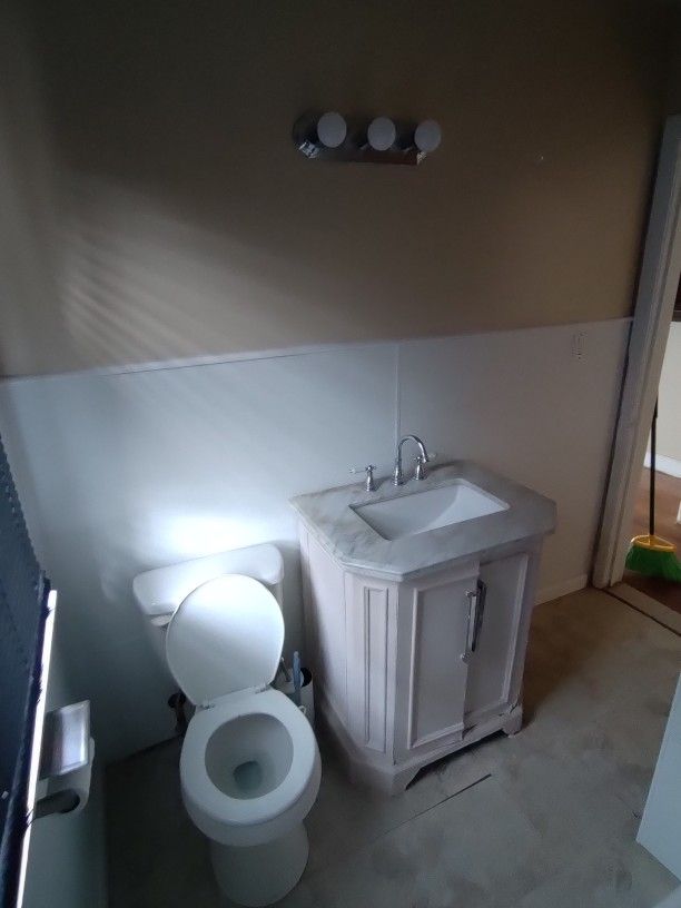 bathroom with vanity and toilet