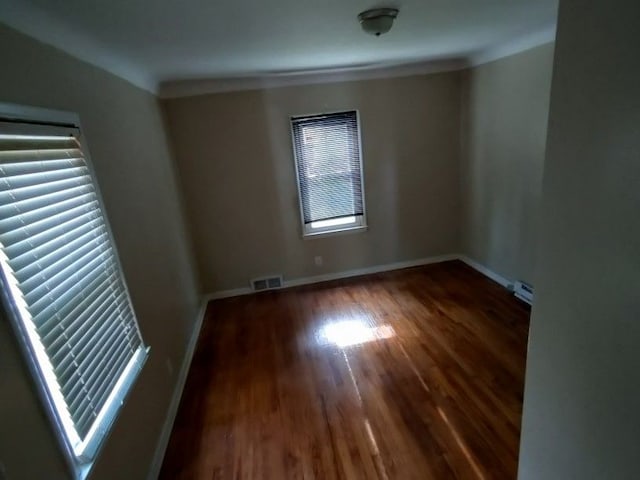 empty room featuring dark hardwood / wood-style flooring