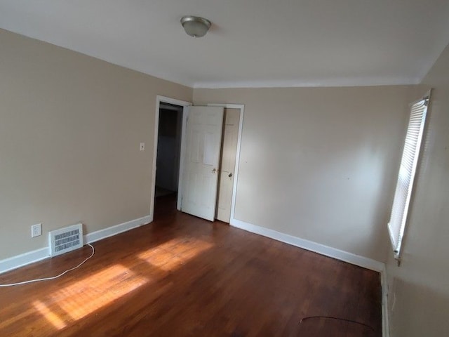 interior space with dark hardwood / wood-style floors and lofted ceiling