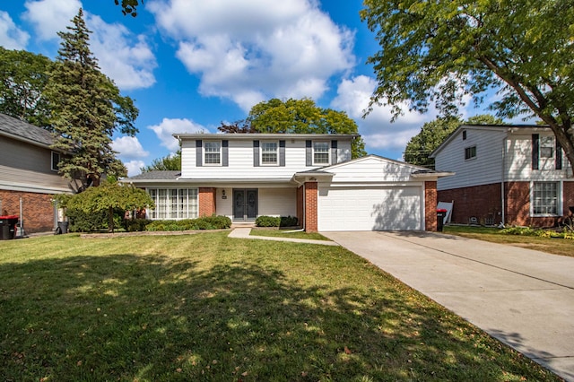 front facade featuring a front yard and a garage