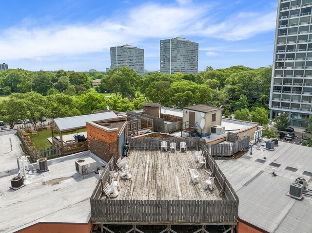 1395 Antietam Ave Unit 57, Detroit, MI 48207 - wooden deck with a view of city and outdoor dining area