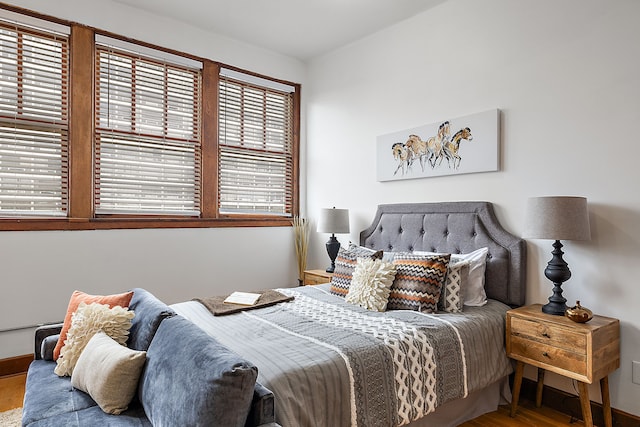 bedroom with hardwood / wood-style floors