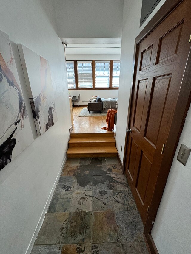 1395 Antietam Ave Unit 57, Detroit, MI 48207 - hall featuring stone finish floors and baseboards