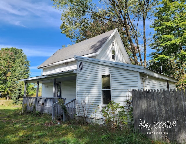 19136 130th Ave, Tustin, MI 49688 - view of side of property featuring covered porch