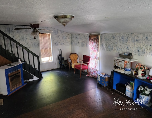 19136 130th Ave, Tustin, MI 49688 - recreation room featuring wood-type flooring, a textured ceiling, wallpapered walls, and a ceiling fan