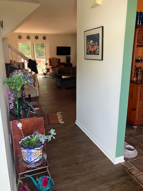 hallway featuring dark hardwood / wood-style flooring