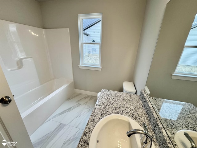 bathroom featuring vanity and toilet