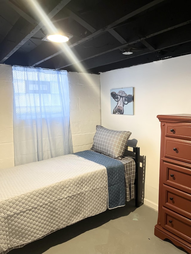 bedroom with concrete flooring