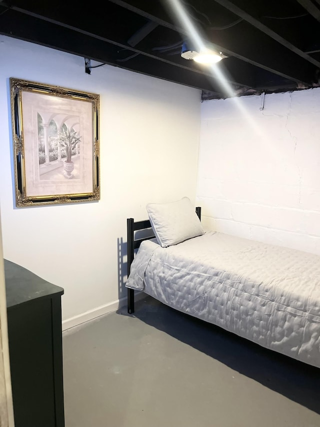 bedroom with concrete flooring