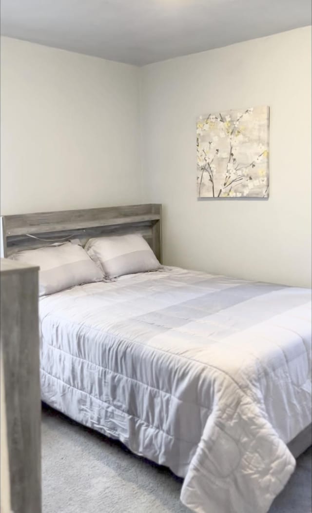 bedroom featuring carpet flooring