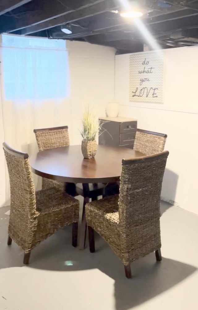 dining space featuring concrete floors