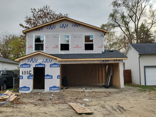 unfinished property with a garage