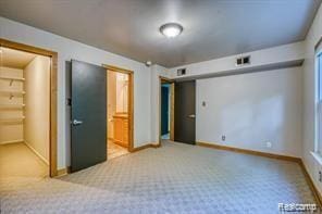 527 E University Dr Unit 1108, Rochester, MI 48307 - unfurnished bedroom featuring carpet flooring and connected bathroom