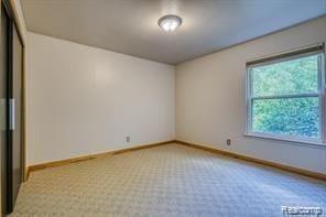 527 E University Dr Unit 1108, Rochester, MI 48307 - spare room featuring baseboards and light colored carpet