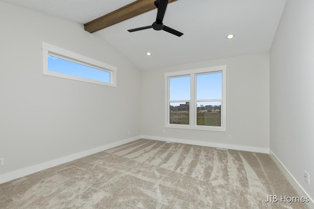 carpeted empty room with lofted ceiling with beams and ceiling fan