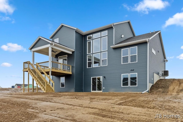 back of house with ceiling fan