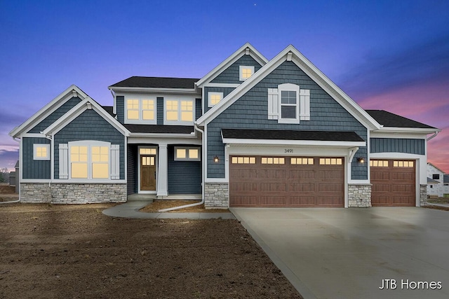 craftsman inspired home with a garage