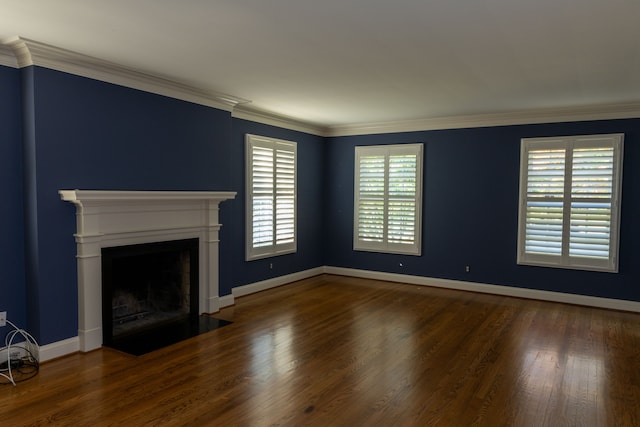 unfurnished living room featuring dark hardwood / wood-style floors and crown molding